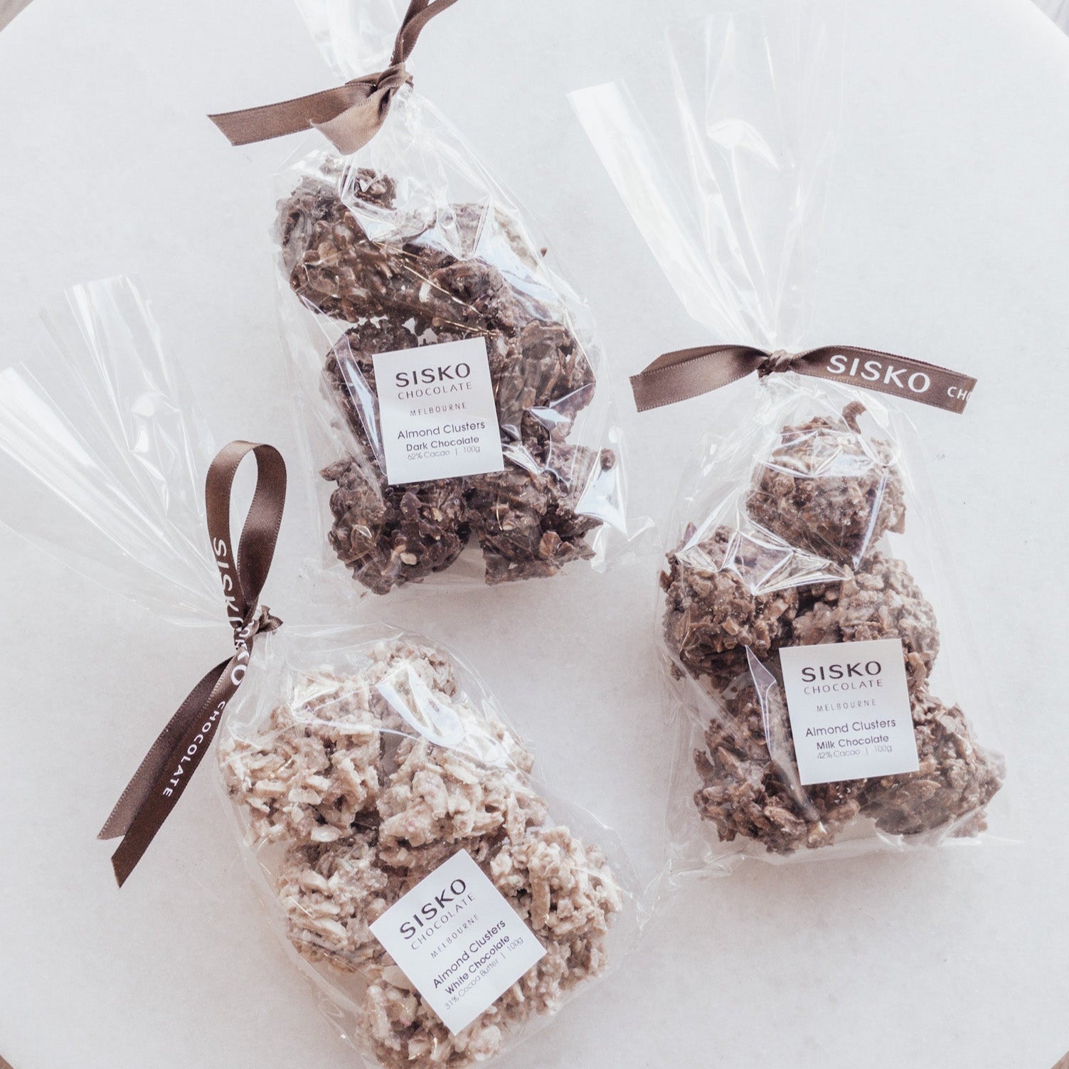 Premium chocolate almond clusters with raspberry and pistachio